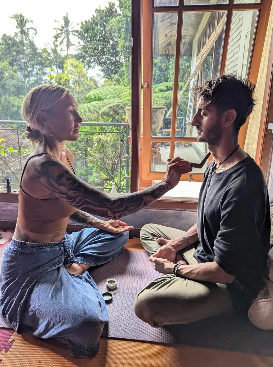 Kambo ceremony preparation in sacred healing space with jungle view