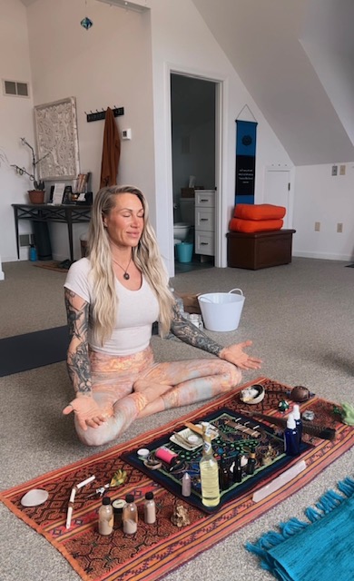 Kambo practitioner in meditation with sacred ceremony tools
